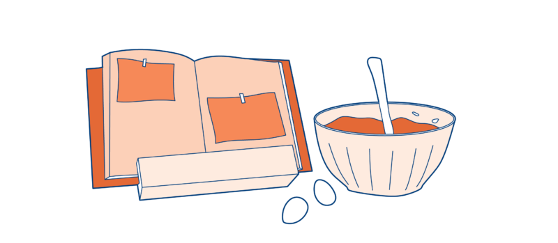 recipe book and bowl of food