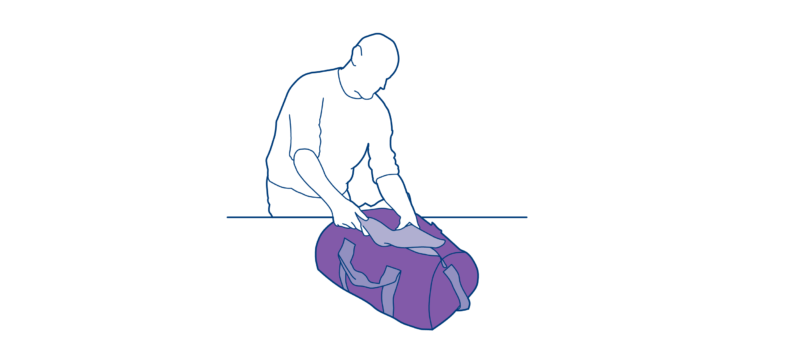 person packing a bag